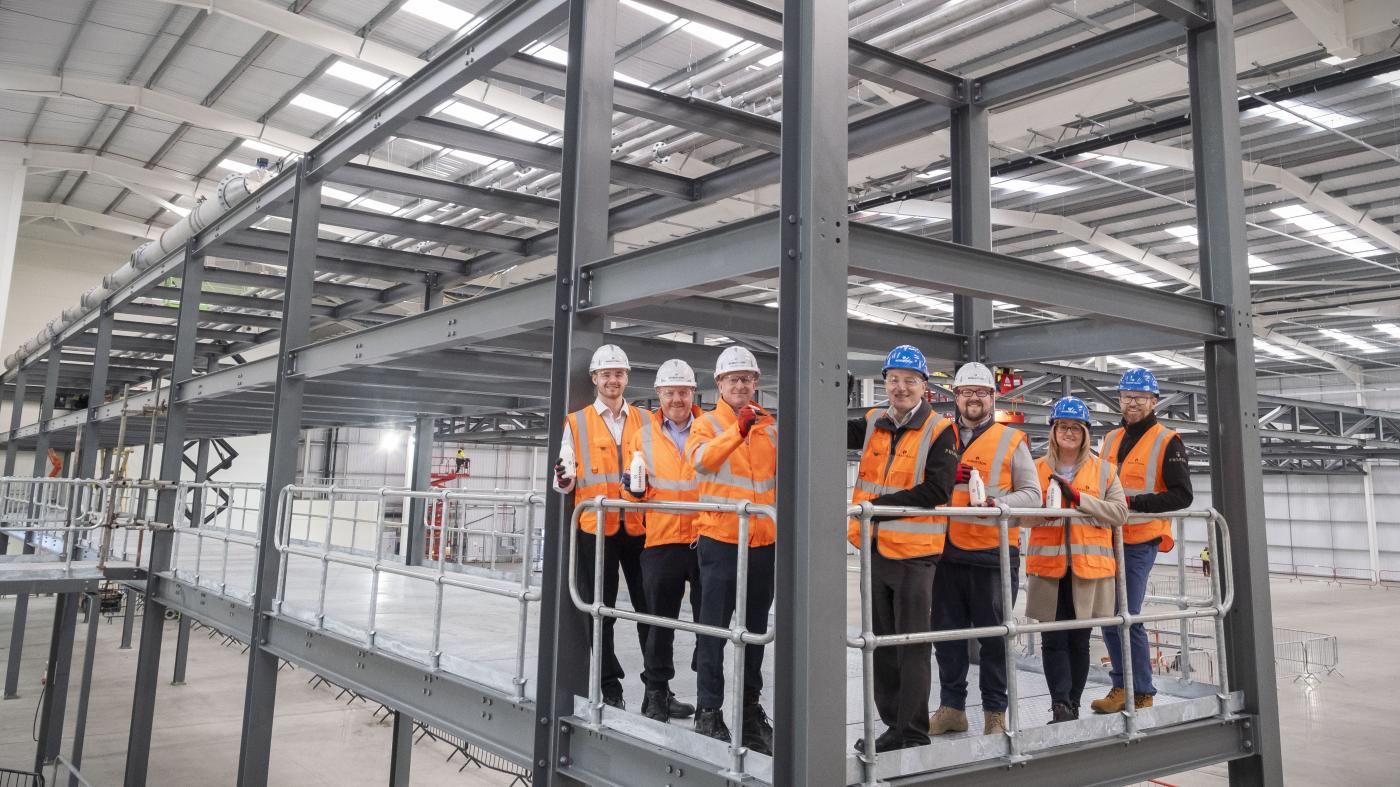Sustainable packaging technology company Pulpex and main contractor Robertson Construction Central West have marked a major milestone on the construction of a new 87,000 sqft manufacturing facility near Glasgow Airport.