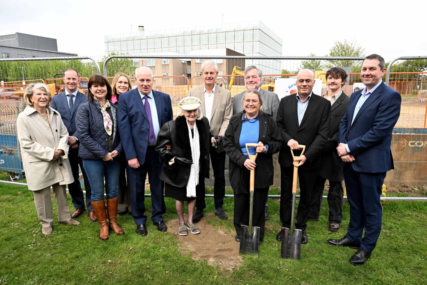 People stood around with spades for the groundbreaking ceremony of the Sir Bobby Robson Institute