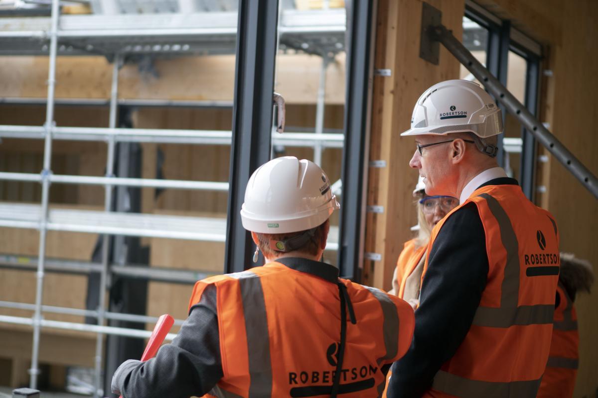 John Swinney visits cross laminated timber frame at Merkinch Primary School