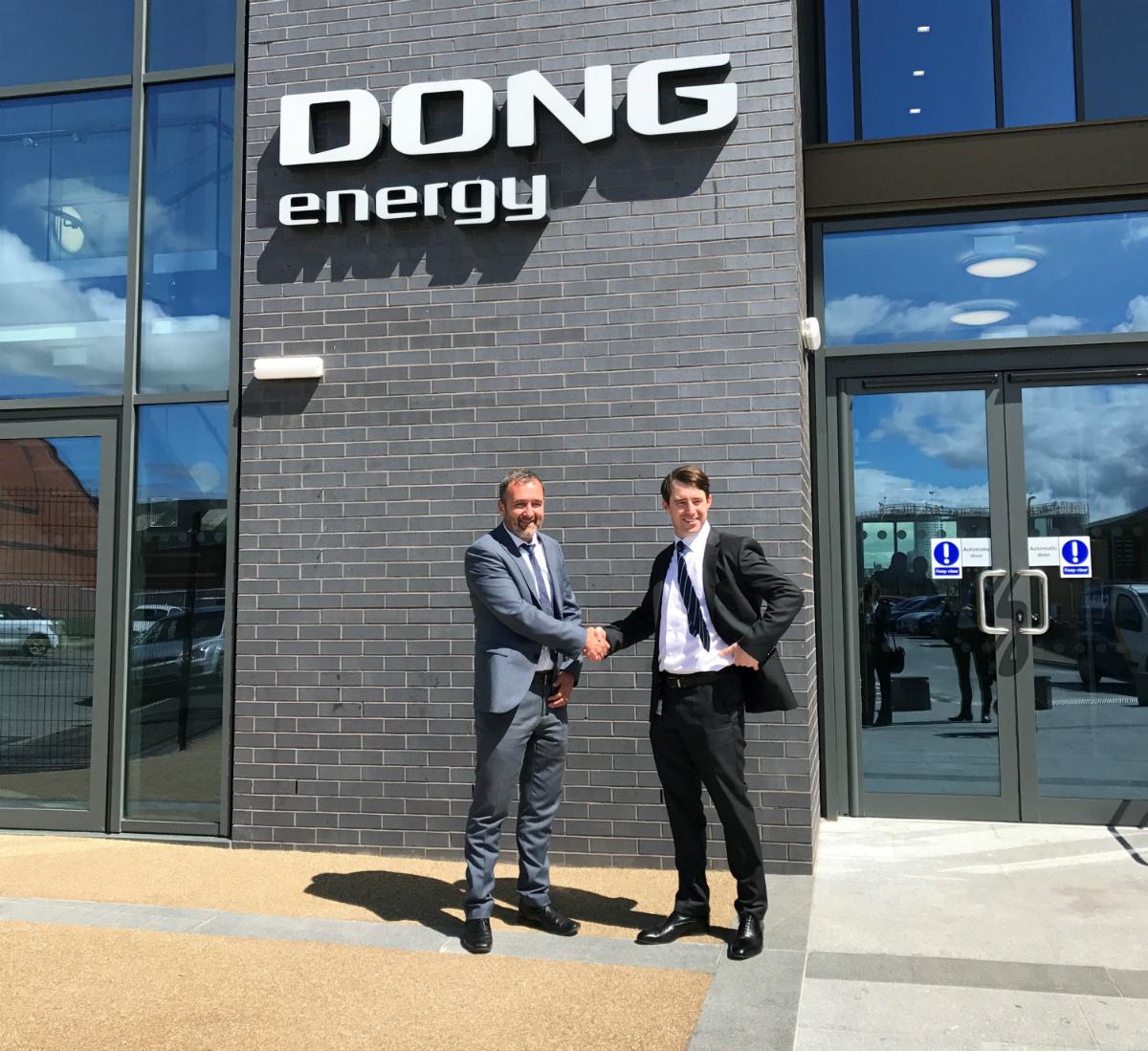 external image of DONG energy building with two men shaking hands